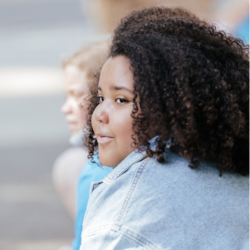 A Girls on the Run participant looks off into the distance during a program practice